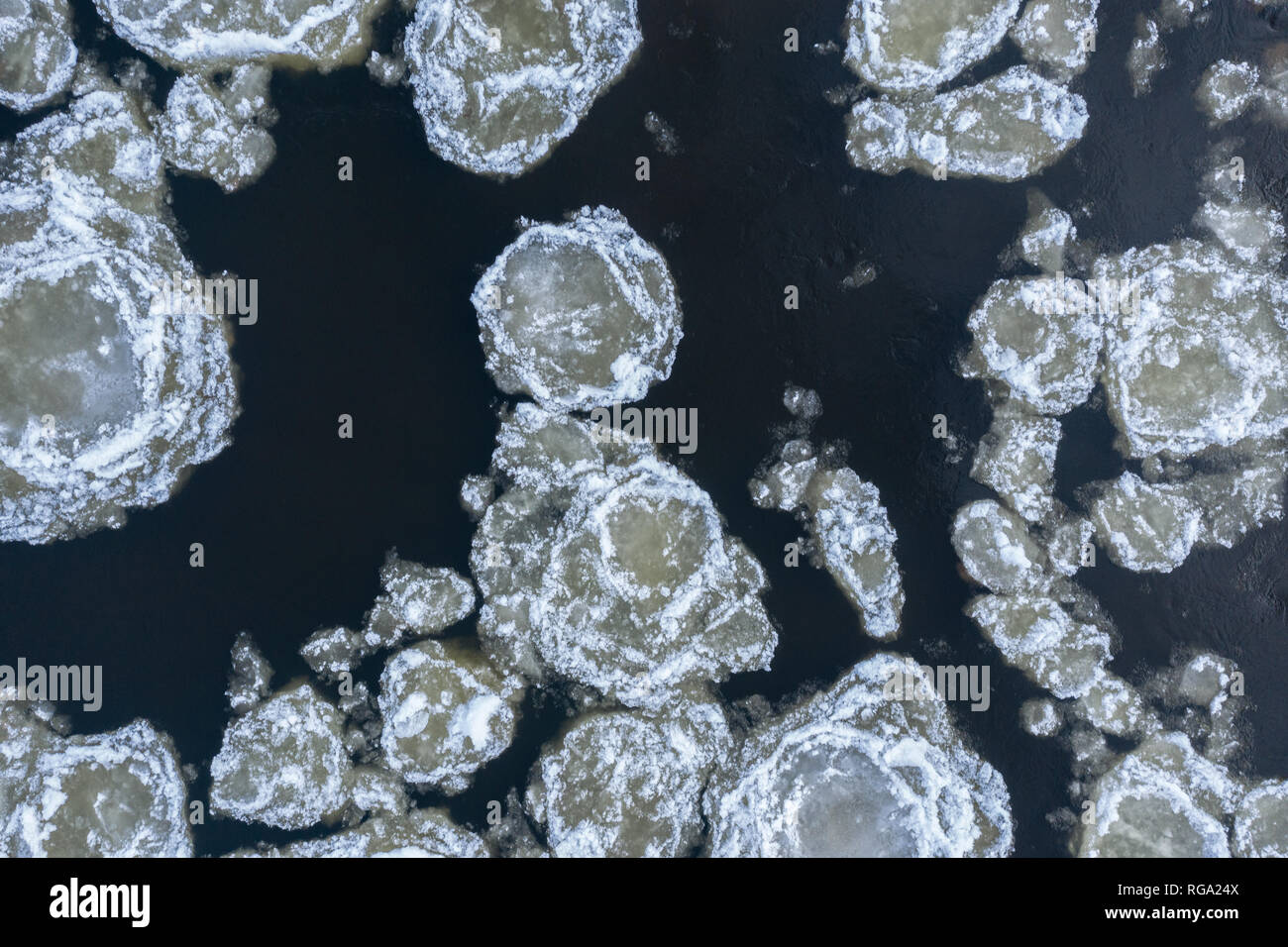 Aerial view of broken ice floating in water hi-res stock photography ...