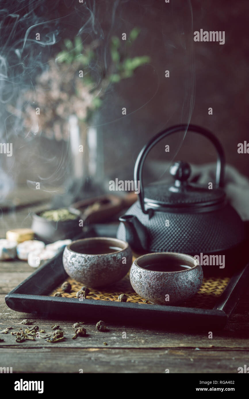 Stilllife of japanese healthy green tea in a small cups and teapot