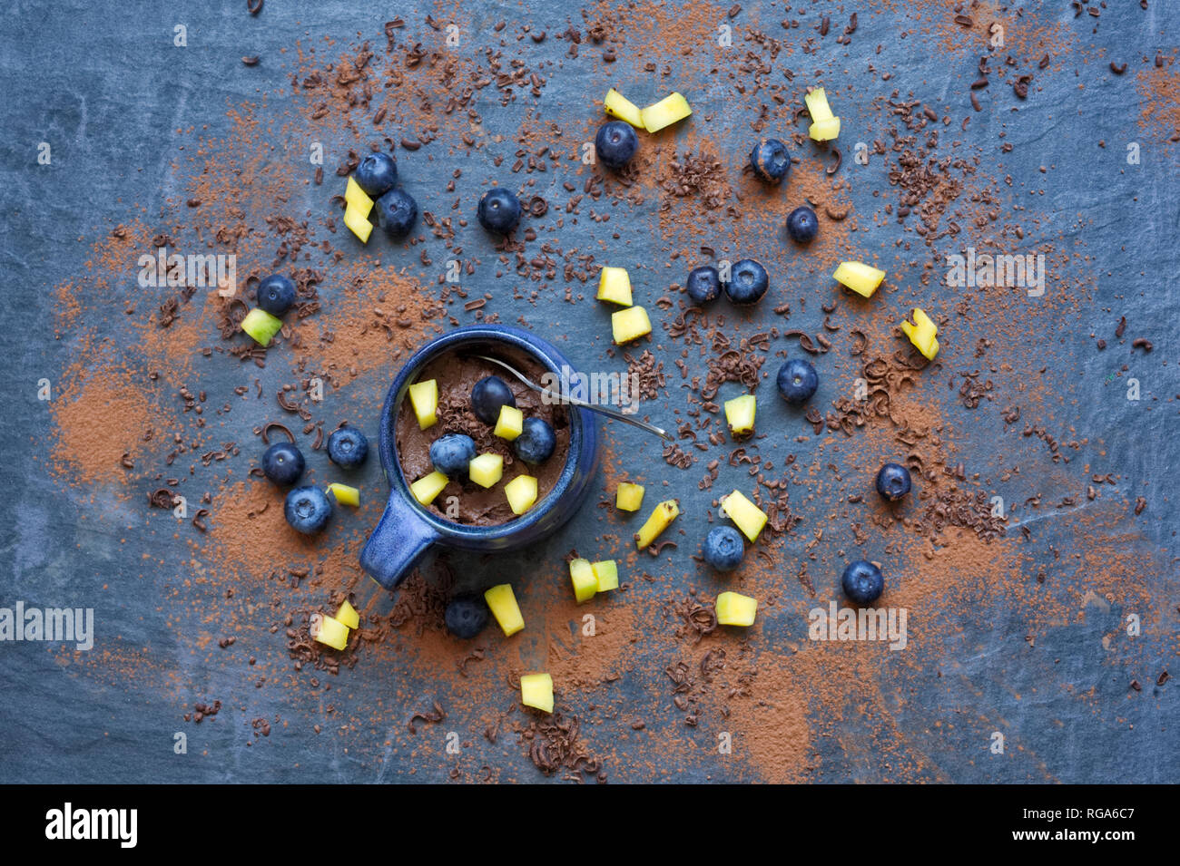 Chocolate Avocado mousse on a slate background. Stock Photo