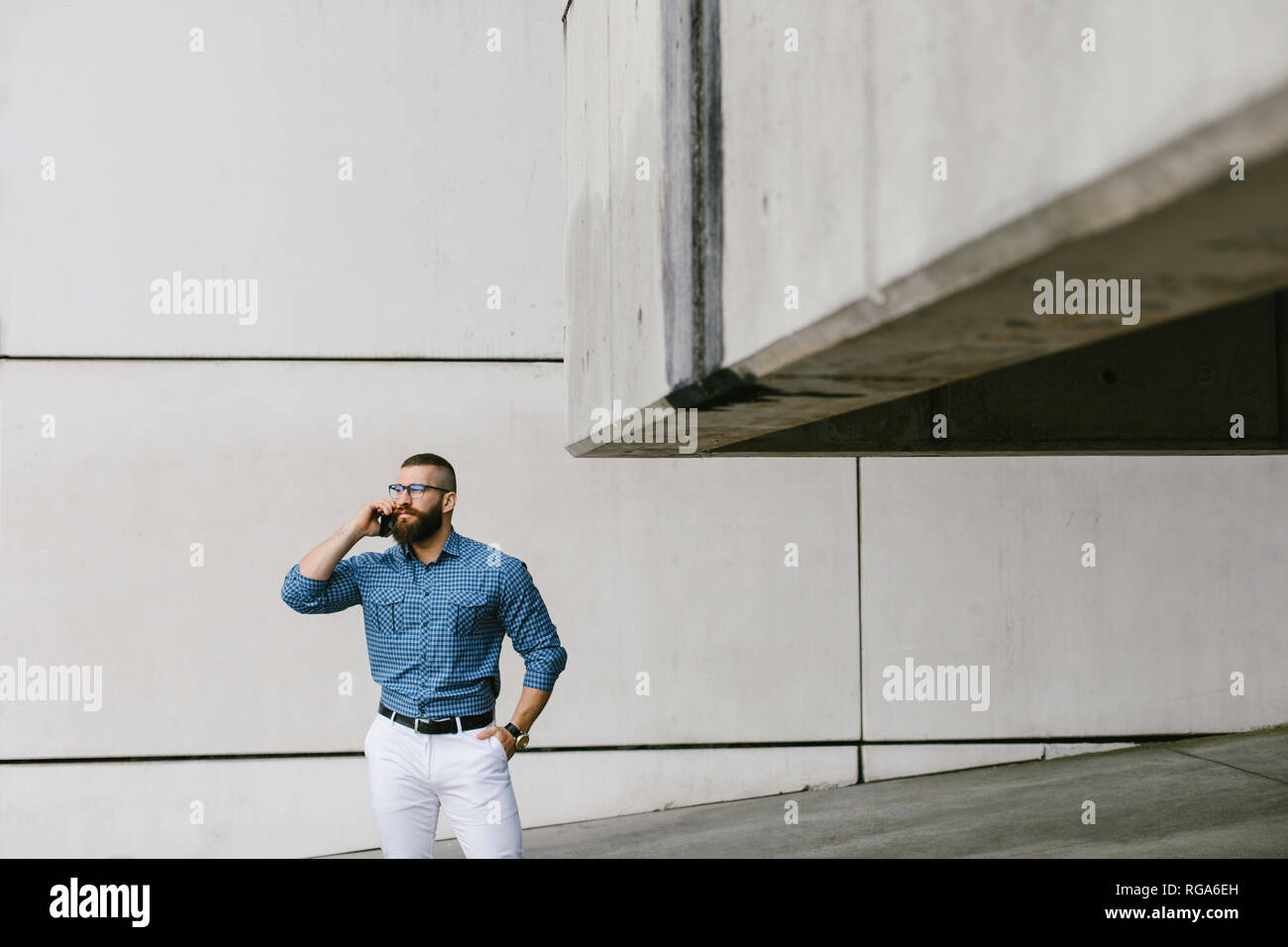 Bearded hipster businessman on the phone Stock Photo