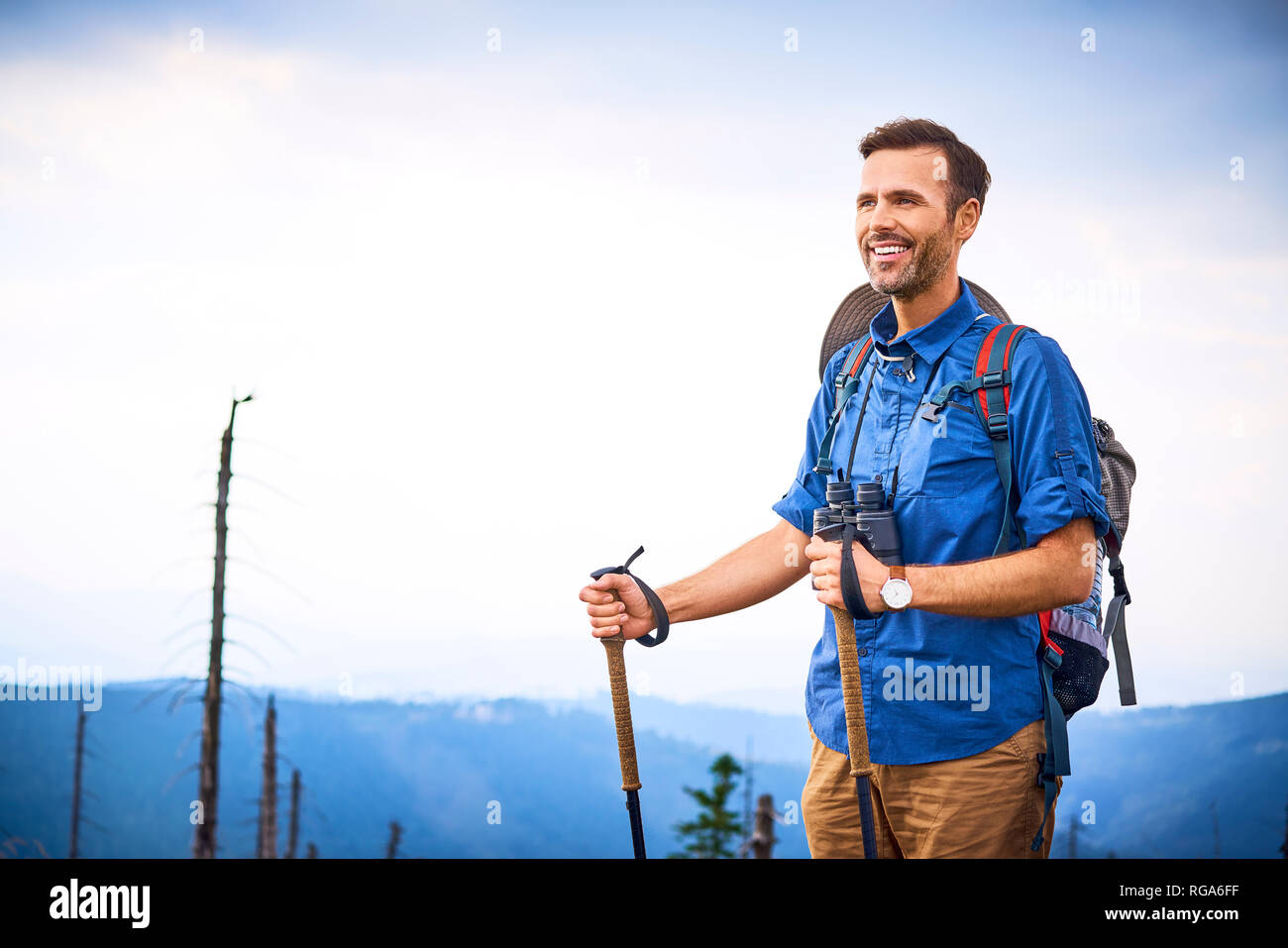 Portrait of smiling man during hiking trip Stock Photo