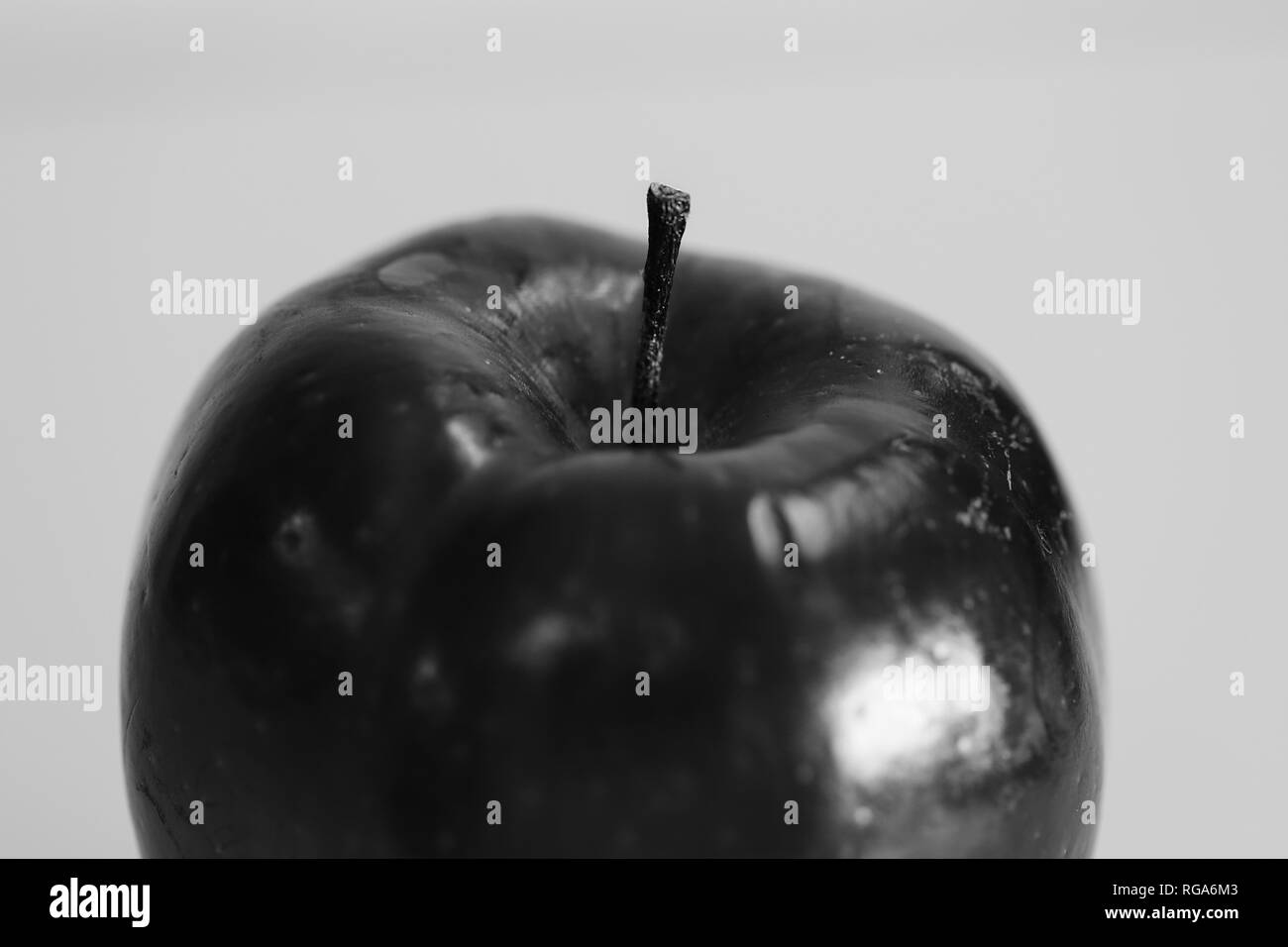 Macro photo of a Red Delicious apple. Beautiful closeup shows the details of this fruit. Black and white photo. Stock Photo
