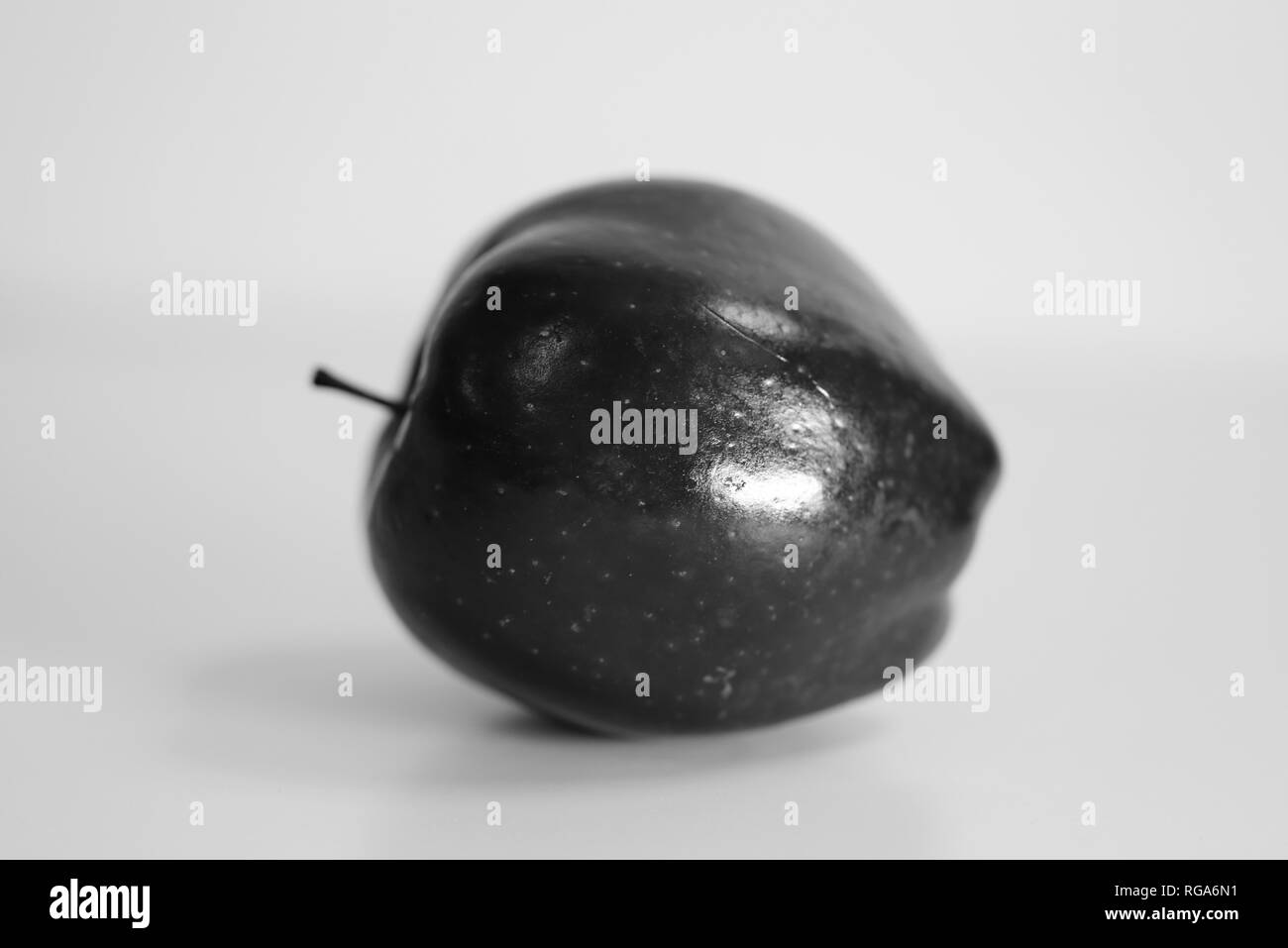 Macro photo of a Red Delicious apple. Beautiful closeup shows the details of this fruit. Black and white photo. Stock Photo