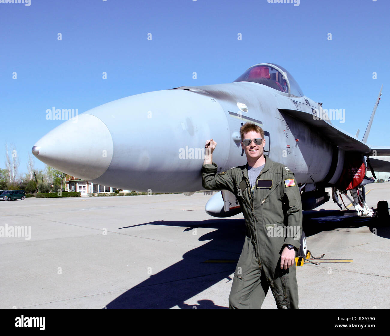 United States Fighter Pilot in full flight gear standing at the front of his jet Stock Photo
