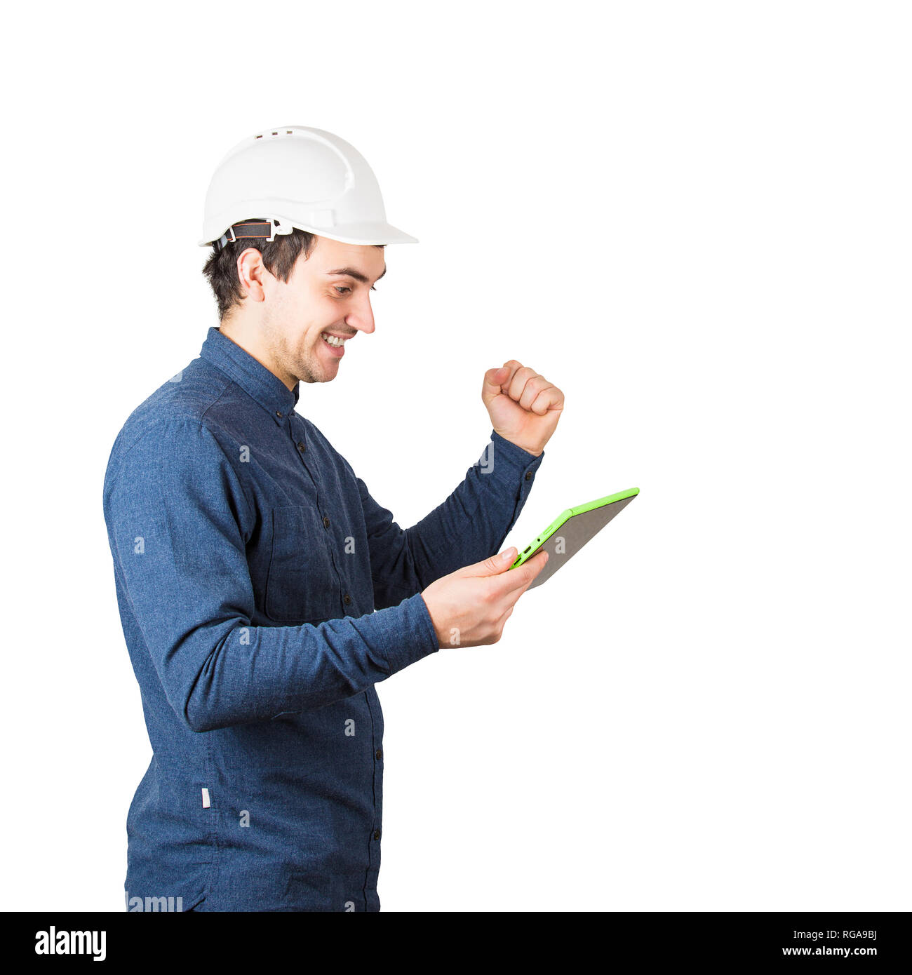 Side view of cheerful young man engineer wearing protective helmet ...
