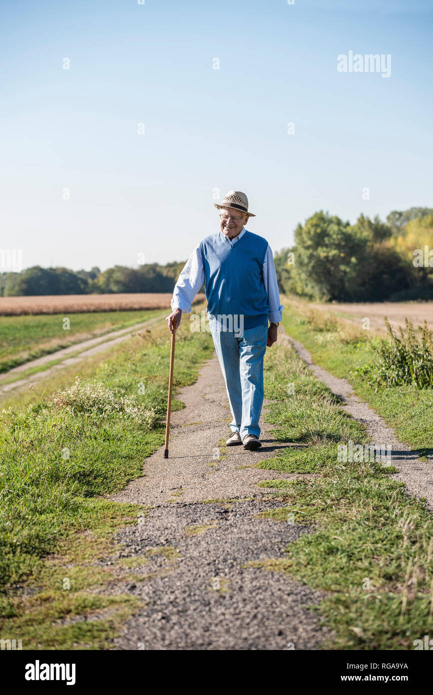 Senior walking stick hi-res stock photography and images - Alamy