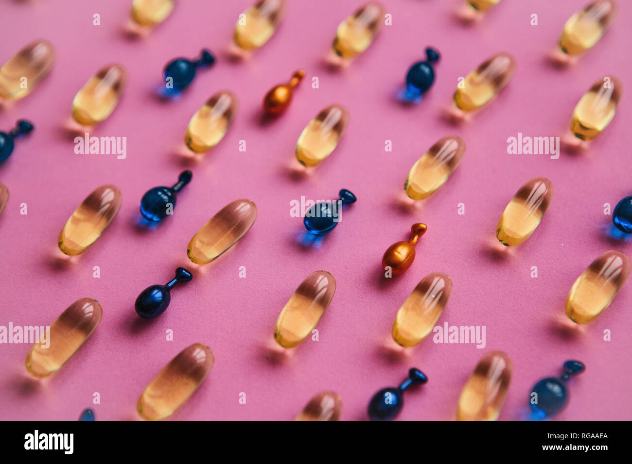 Capsule background with Omega 3, hyaluronic acid and coenzyme. Caring