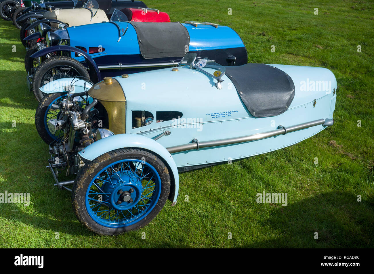 A row of classic vintage Morgan 3-wheeler sports cars at Prescott Hill Climb, Gloucestireshire Stock Photo