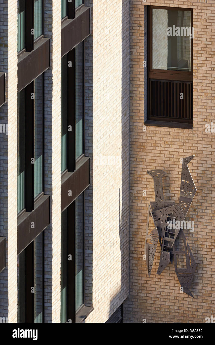 Detail of brick facade and wall sculpture. Paul Street, London, United Kingdom. Architect: Stiff + Trevillion Architects, 2018. Stock Photo