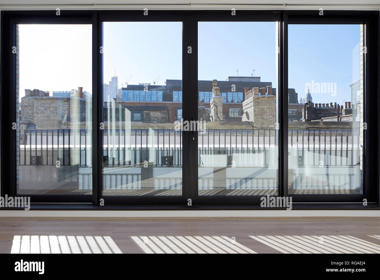 Picture window of penthouse. Paul Street, London, United Kingdom. Architect: Stiff + Trevillion Architects, 2018. Stock Photo