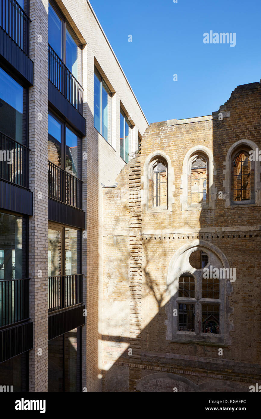 Joint of historic church and new office facade. Paul Street, London, United Kingdom. Architect: Stiff + Trevillion Architects, 2018. Stock Photo
