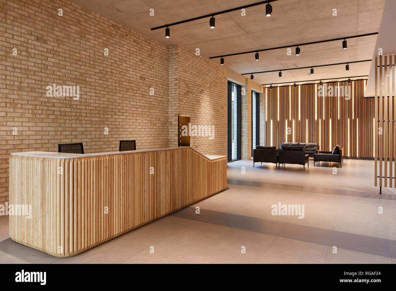 Ground floor reception and lounge. Paul Street, London, United Kingdom. Architect: Stiff + Trevillion Architects, 2018. Stock Photo