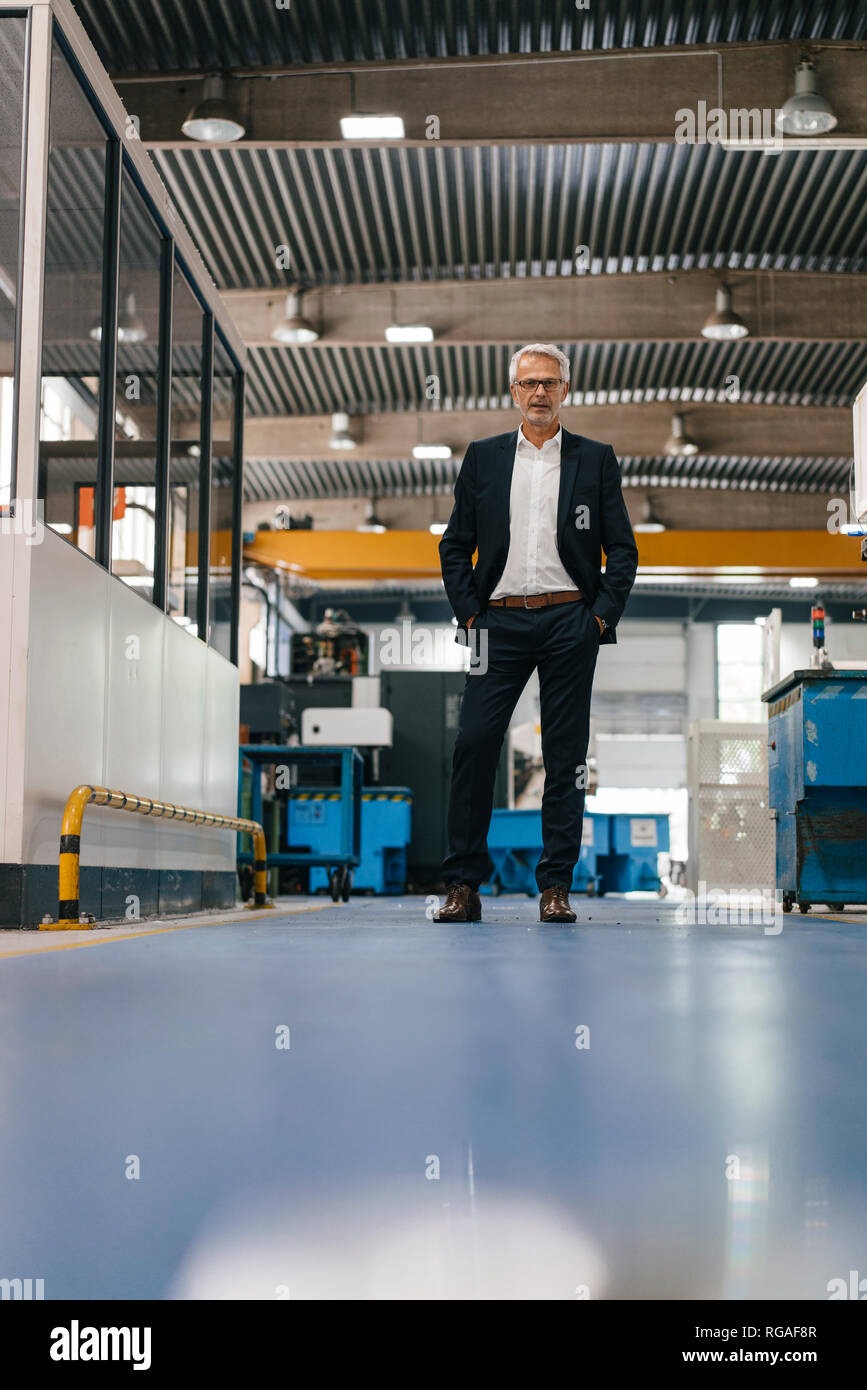 Successful entrepreneur in factory workshop of his company Stock Photo