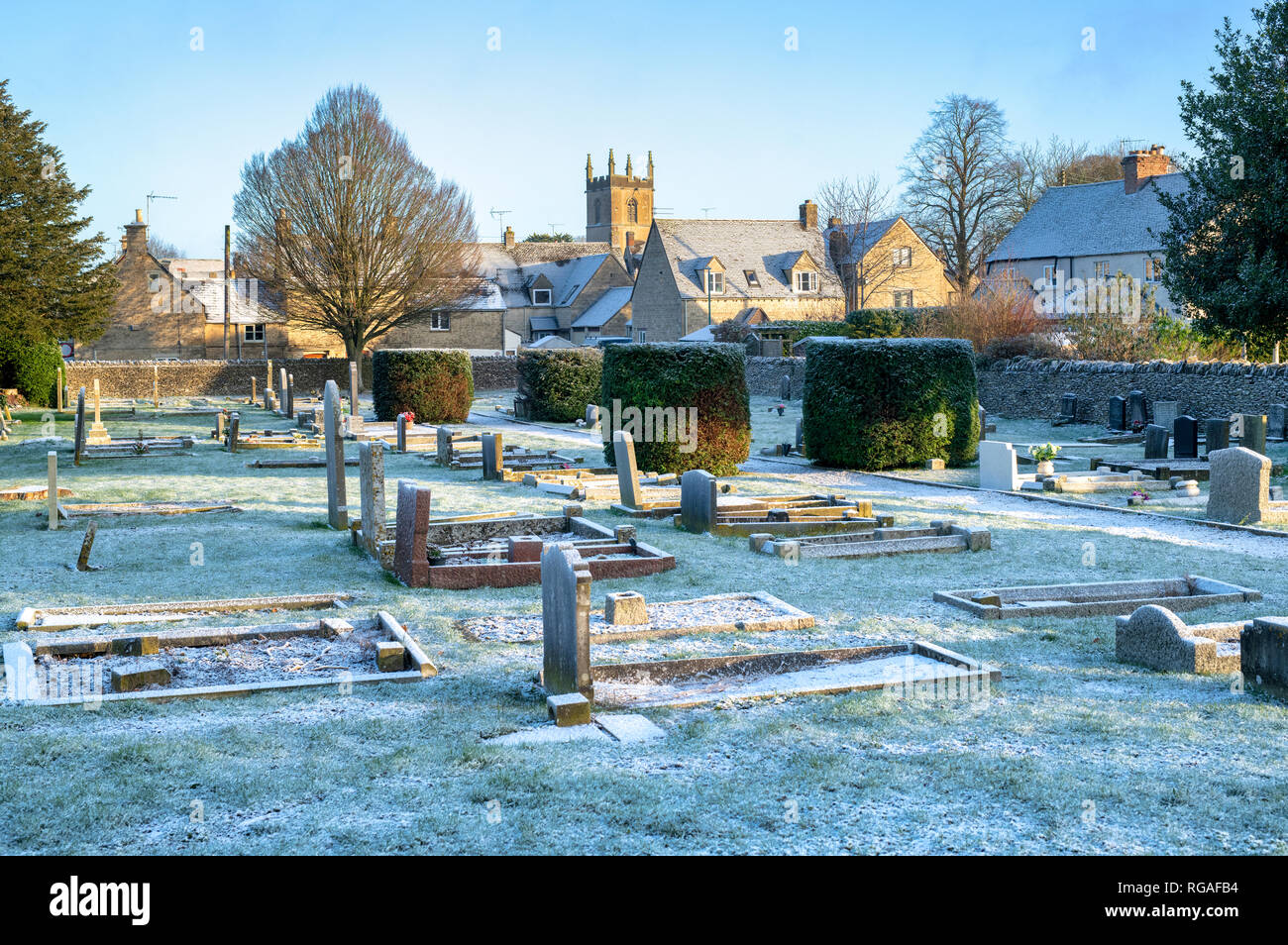 Light winter snow in a cemetery. Stow on the Wold, Cotswolds, Gloucestershire, England Stock Photo