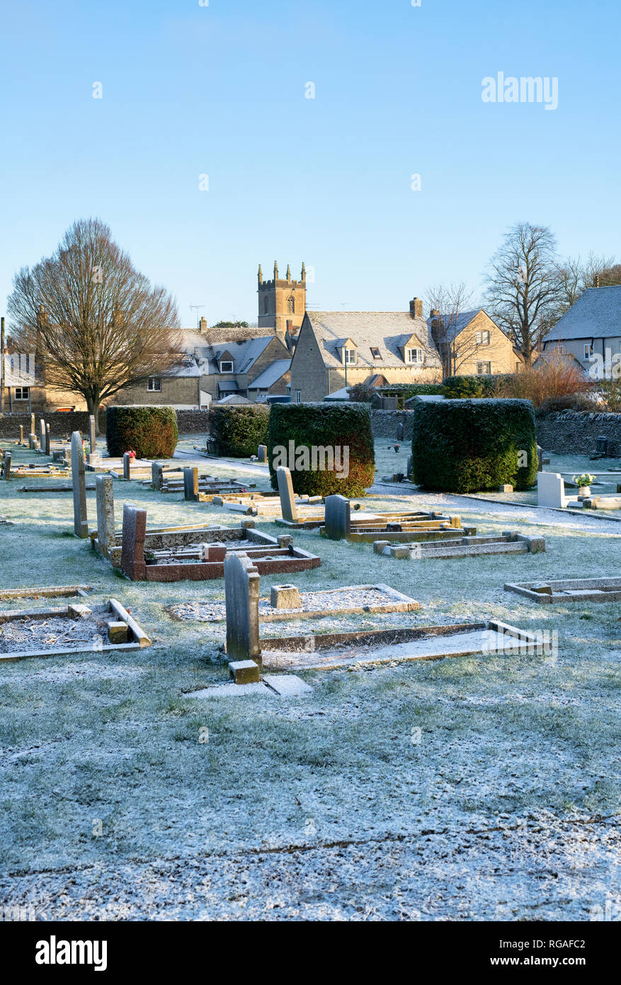 Light winter snow in a cemetery. Stow on the Wold, Cotswolds, Gloucestershire, England Stock Photo