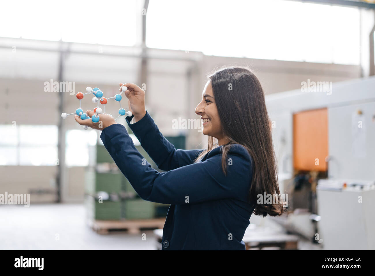 Confident Woman Working In High Tech Enterprise Holding Molecule Model Stock Photo Alamy