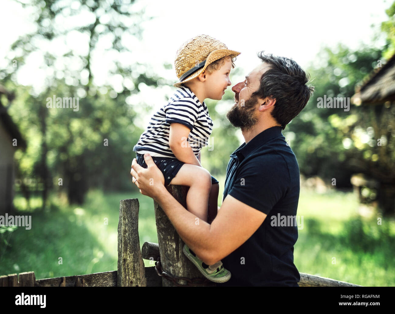 Father and little son spending time together outdoors Stock Photo