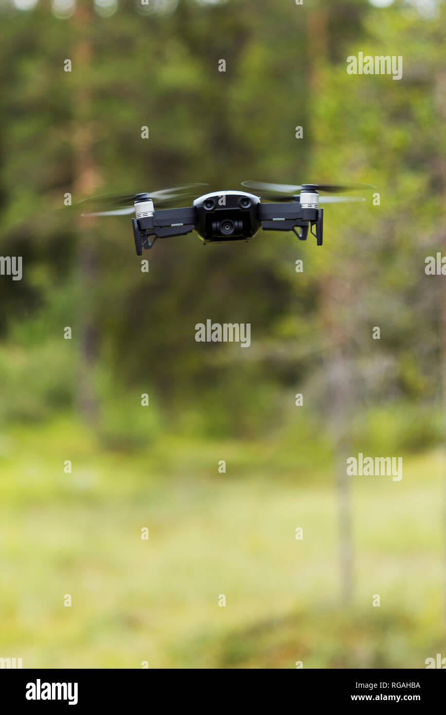 Flying drone with camera Stock Photo