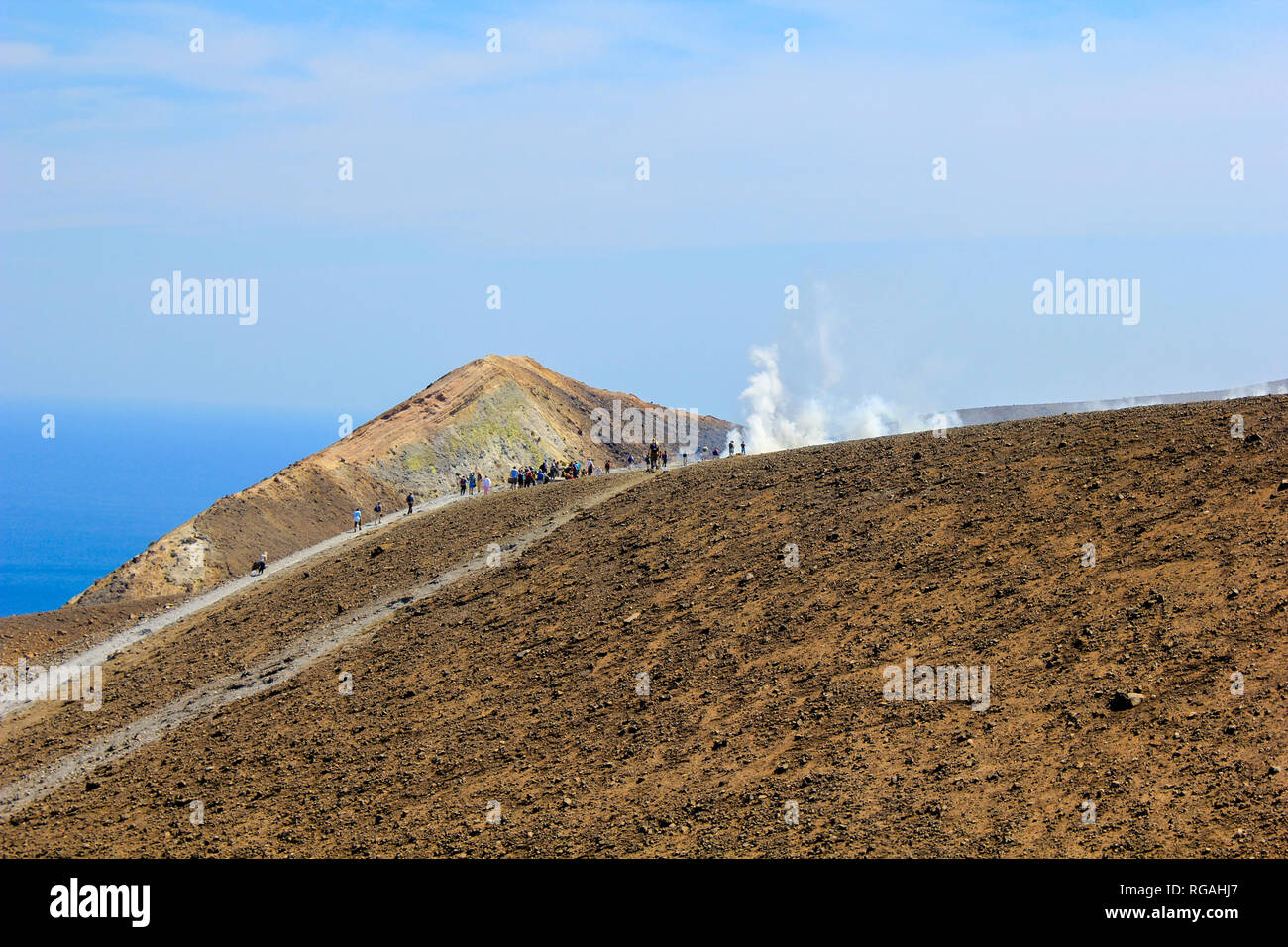 The crater of a volcano at Vulcano Island in Italy attracts tourists with the steams of sulphur. Stock Photo