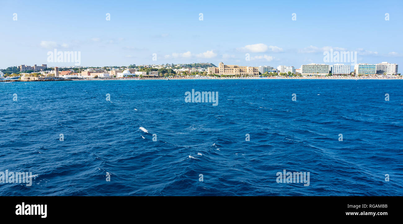 View of coastline of City of Rhodes lined with hotels on Elli beach, PANORAMA (Rhodes, Greece) Stock Photo
