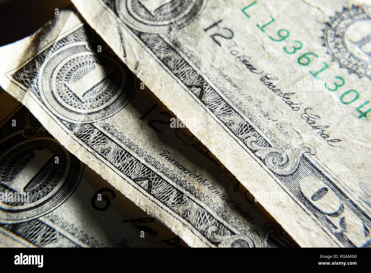 Dolar USA close-up. Old battered crumpled bills macro. The texture of the fragment of the dollar bill. USD banknote texture. Stock Photo