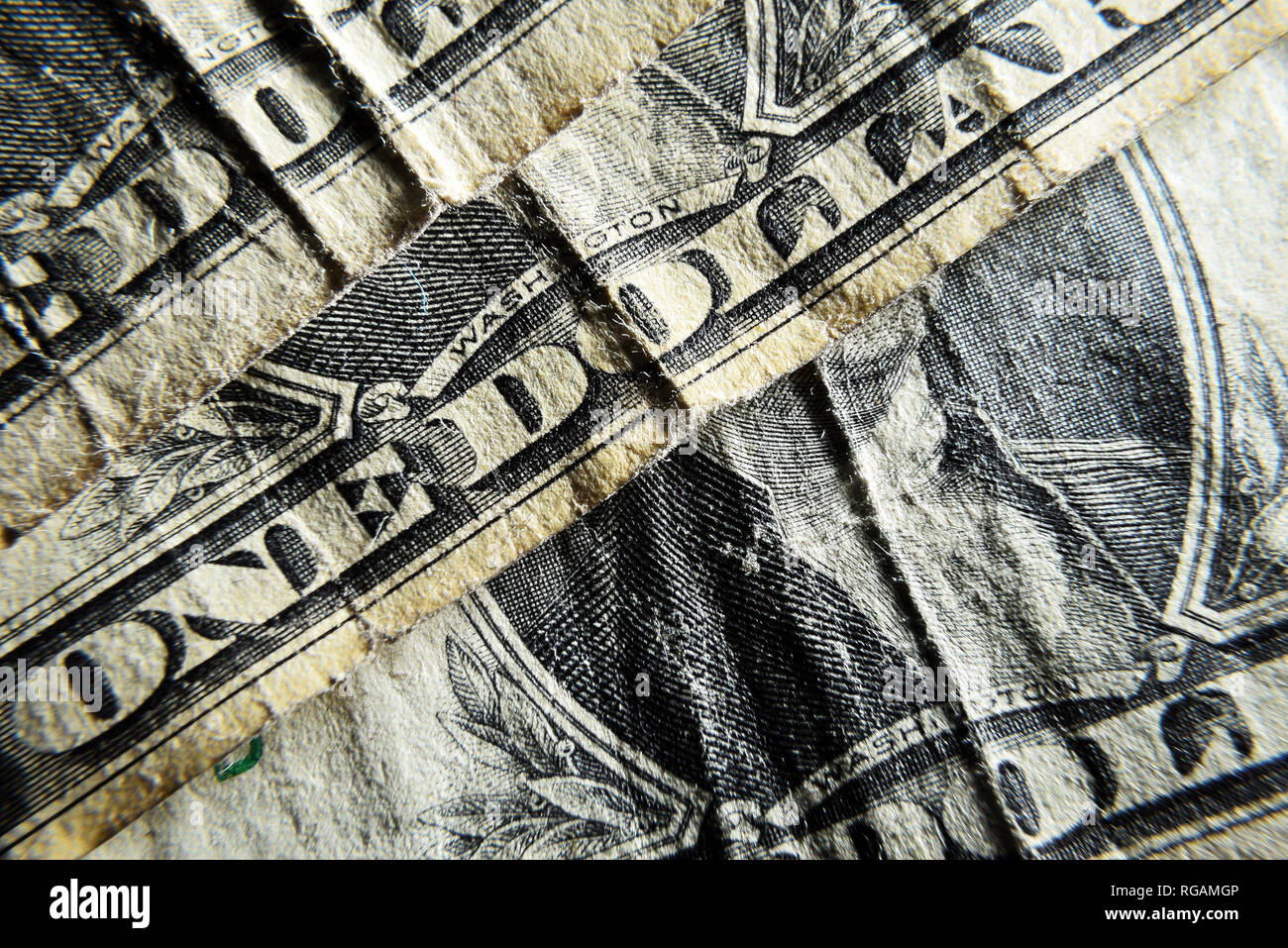 Dolar USA close-up. Old battered crumpled bills macro. The texture of the fragment of the dollar bill. USD banknote texture. Stock Photo