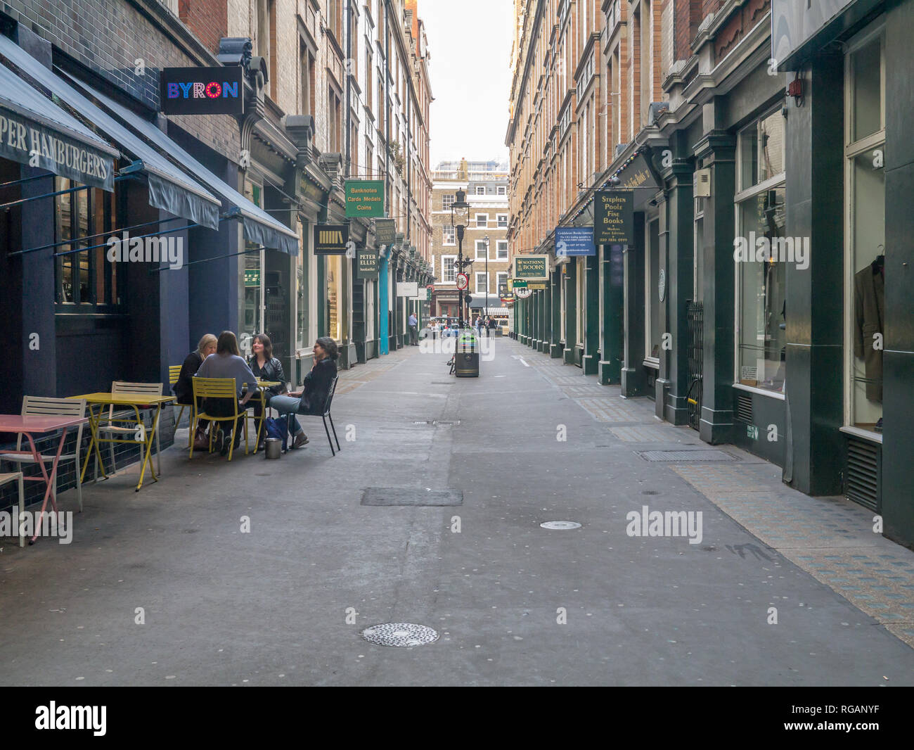 St. Martins, London, UK - May 16, 2014: View looking down Cecil court from St. Martins towards Charring Cross Road.  A narrow alley with many booksell Stock Photo