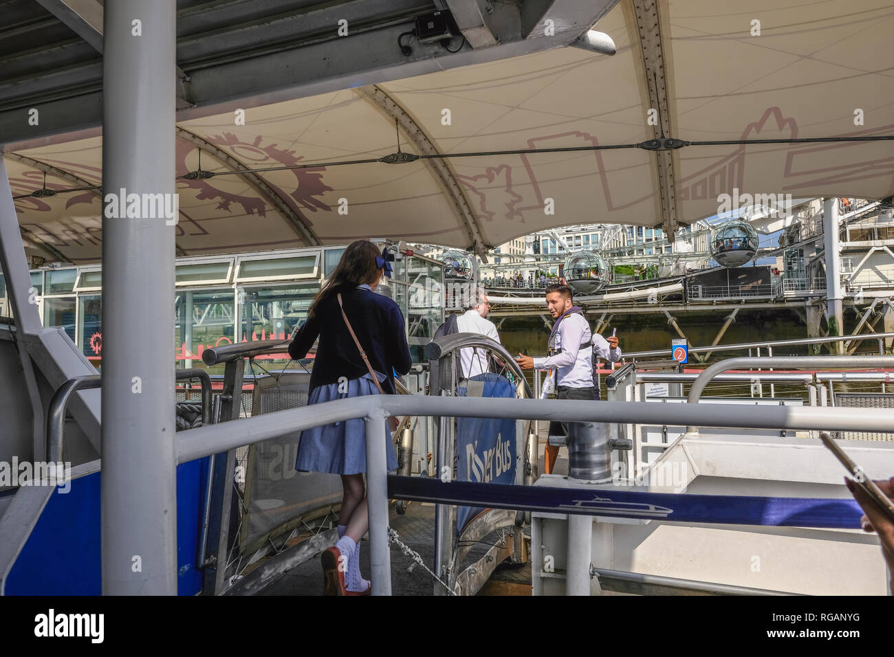 Waterloo, London, UK - June 8, 2018: People disembarking from clipper at its landing place at Waterloo Pier Stock Photo