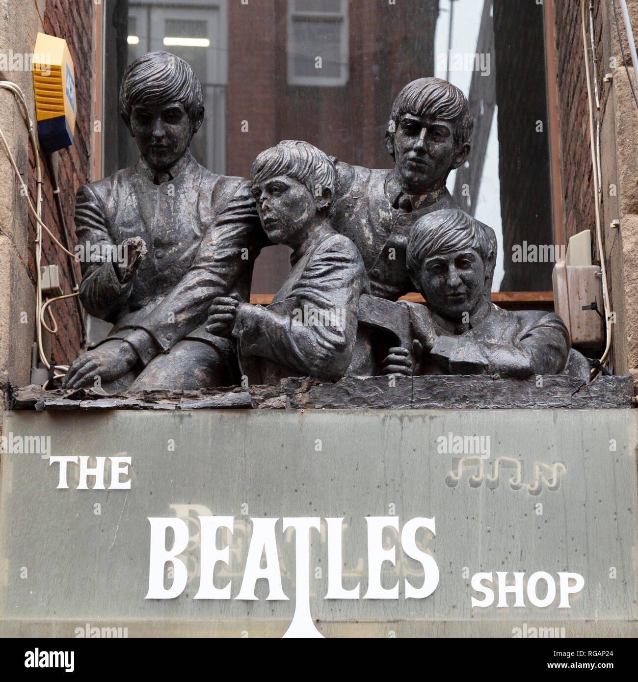 Beatles statue above The Beatles Shop on Matthew Street in Liverpool, England. Stock Photo