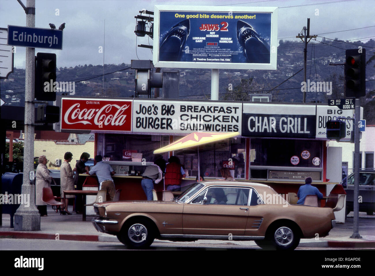 Joe's Big Burger stand  with classic Mustang passing  in Los Angeles, CA circa 1978 Stock Photo