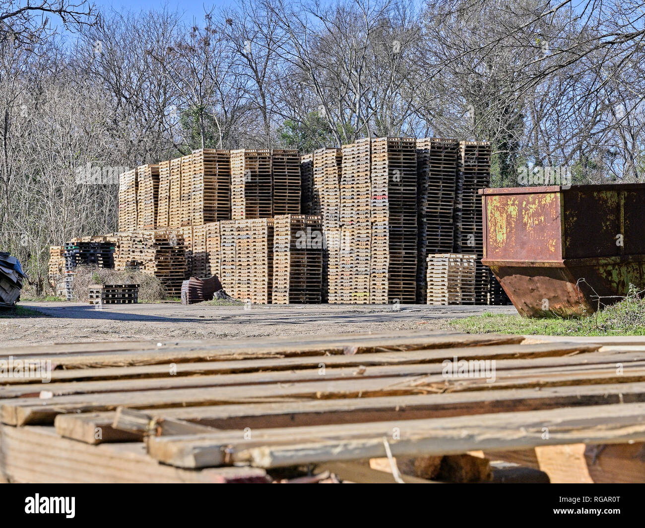 Wooden pallets are stacked high in storage waiting for use in Montgomery Alabama, USA. Stock Photo