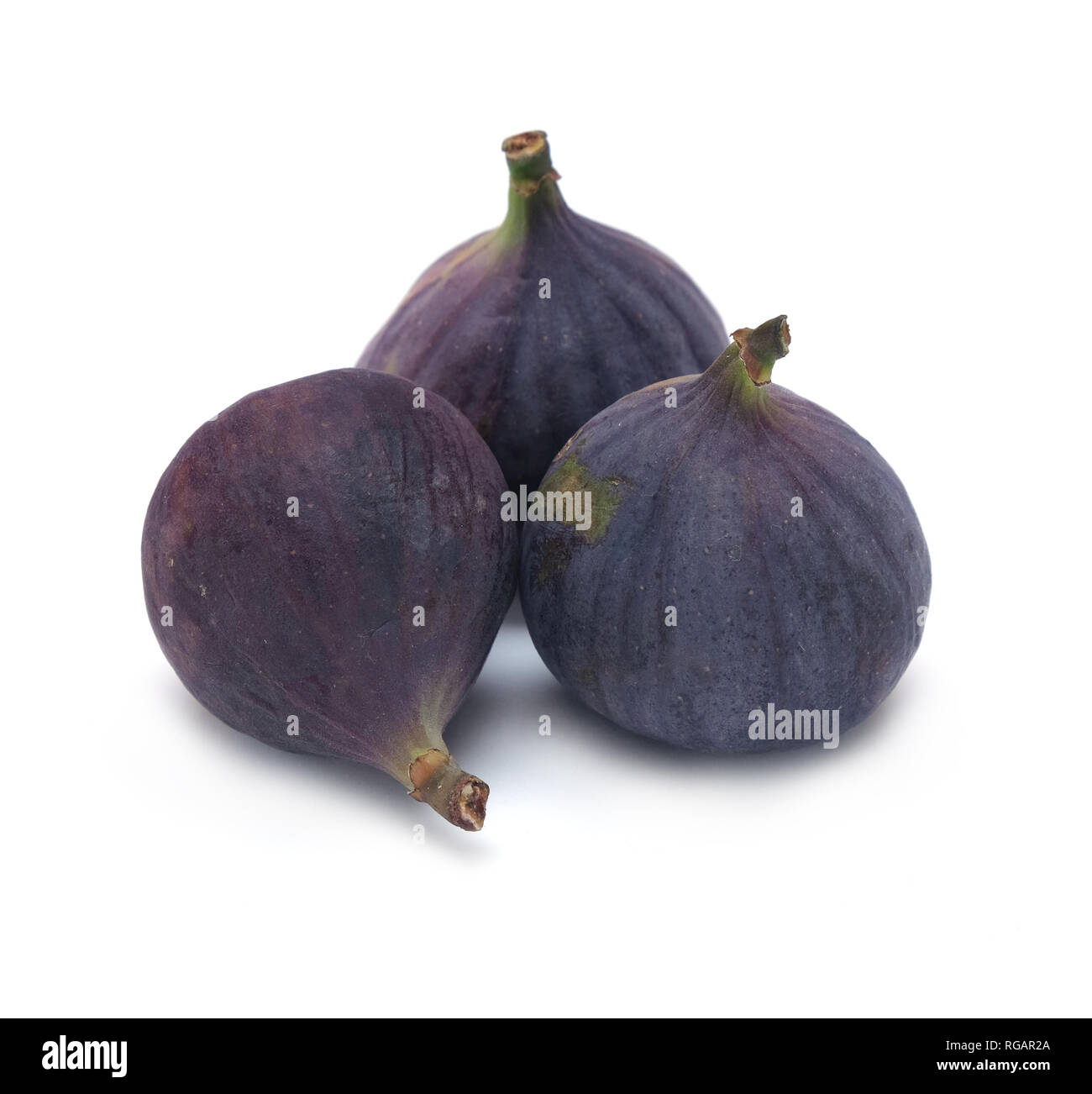 3 Ripe Figs Indoor still-life with three ripe figs fruits isolated on white ...