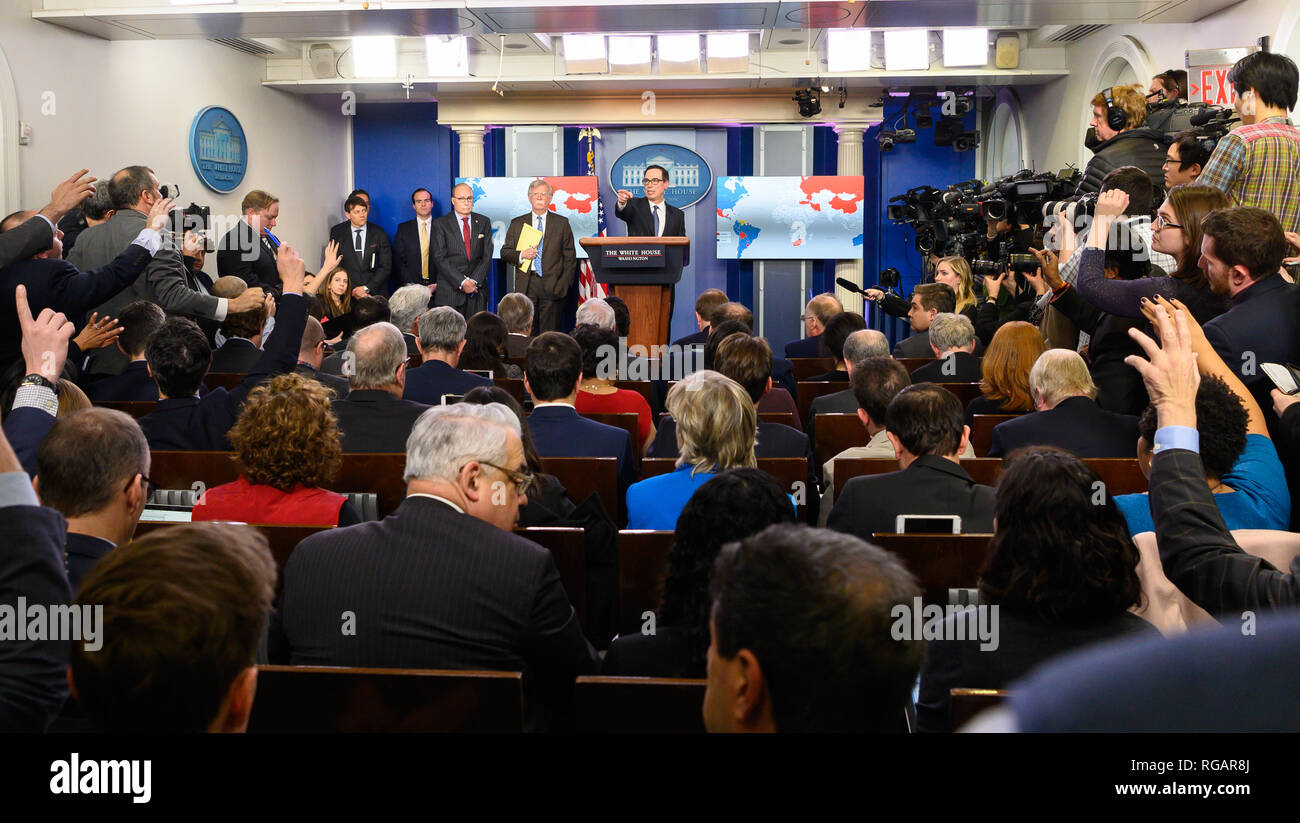 Larry Kudlow, Director of the United States National Economic Council, John Bolton, National Security Advisor of the United States, and Steven Mnuchin, United States Secretary of the Treasury, in the White House Press Briefing room at the White House in Washington, DC . Stock Photo