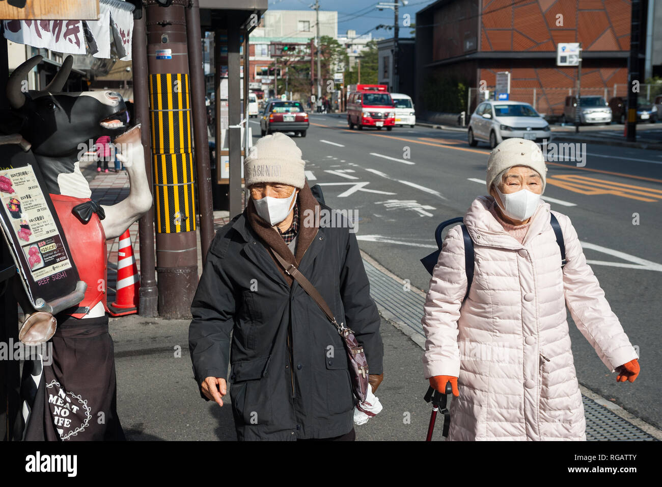 25.12.2017, Kyoto, Japan, Asia - Two elderly Japanese women are walking down a road in the Higashiyama ward. Stock Photo