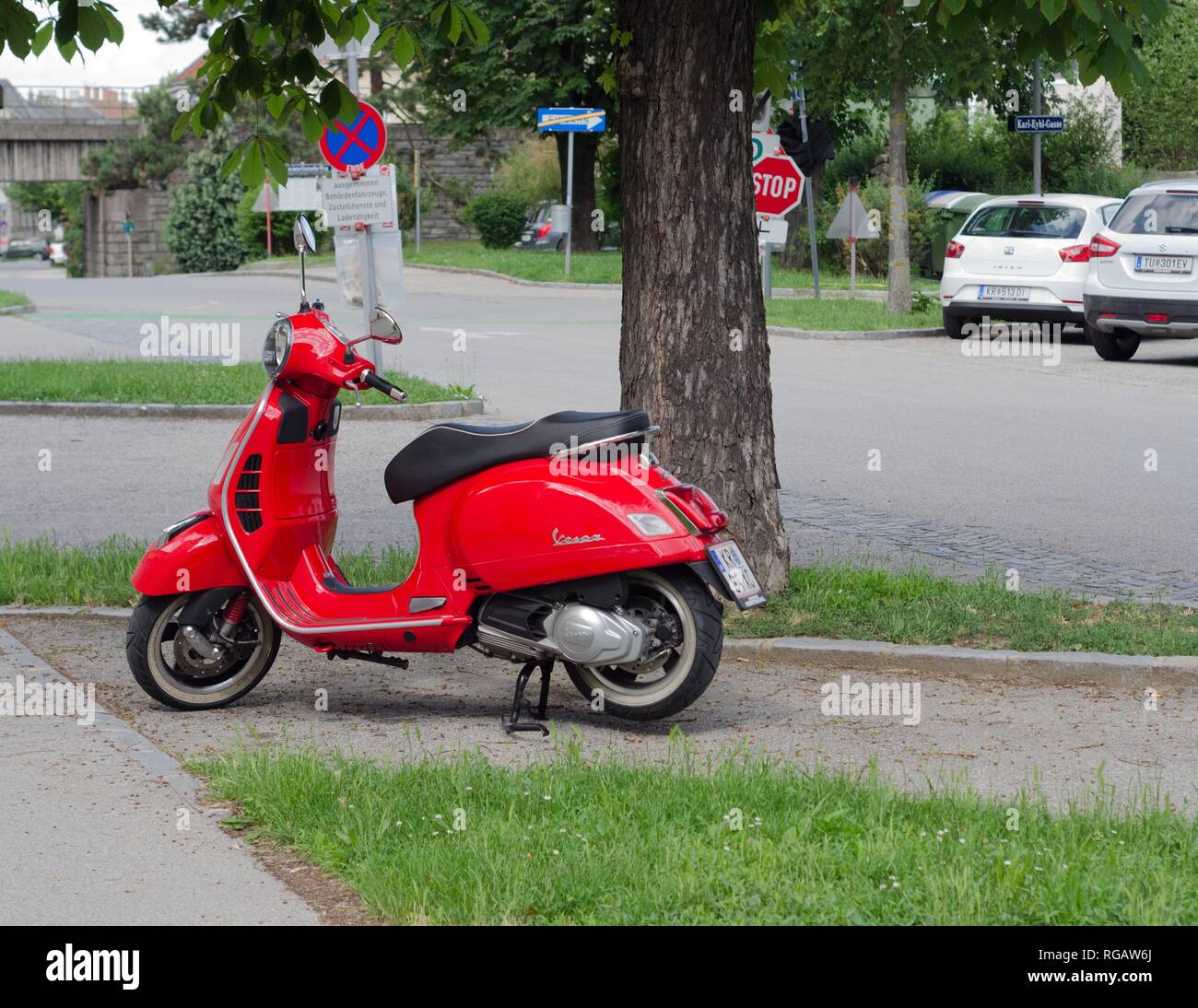 A sparkling red Vespa scooter in Vienna, Austria Stock Photo Alamy