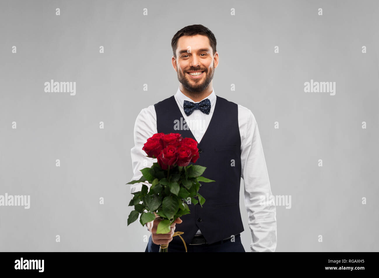 happy man with bunch of red roses Stock Photo - Alamy