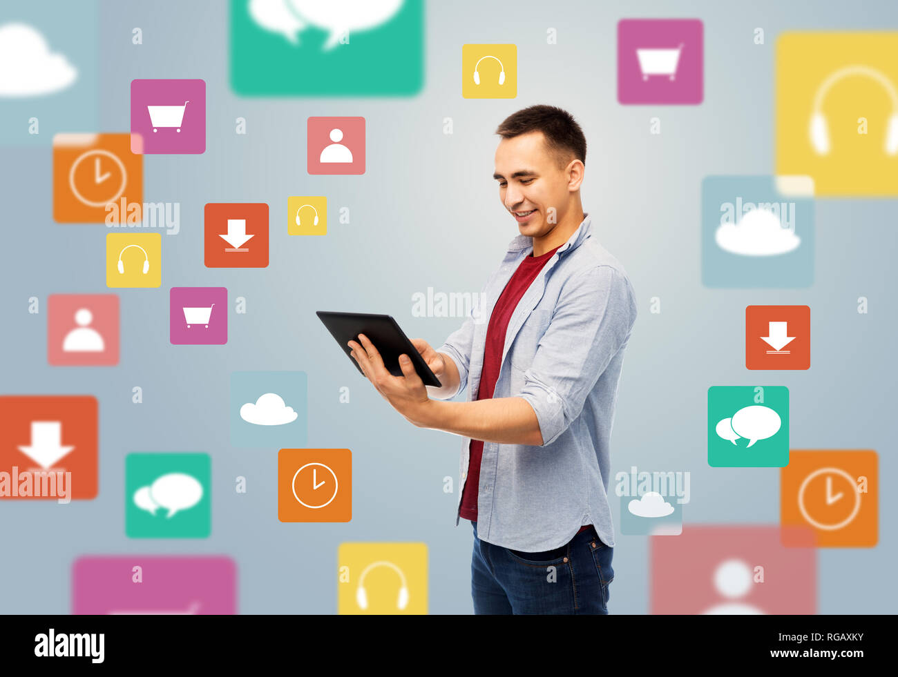 happy young man with tablet over media icons Stock Photo
