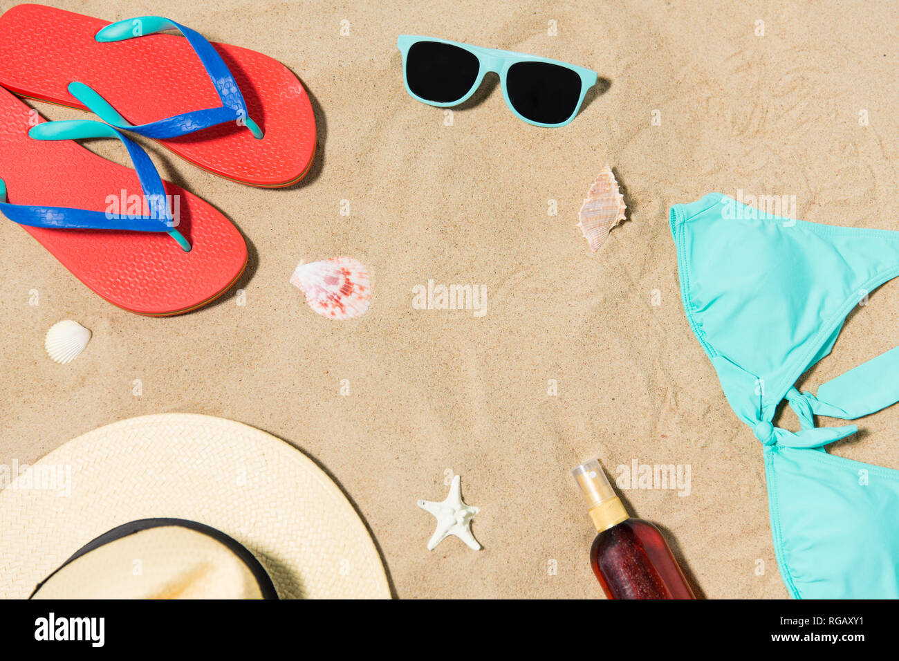 straw hat, flip flops and sunglasses on beach sand Stock Photo - Alamy