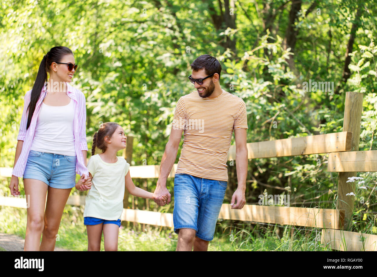 happy family walking in summer park Stock Photo - Alamy