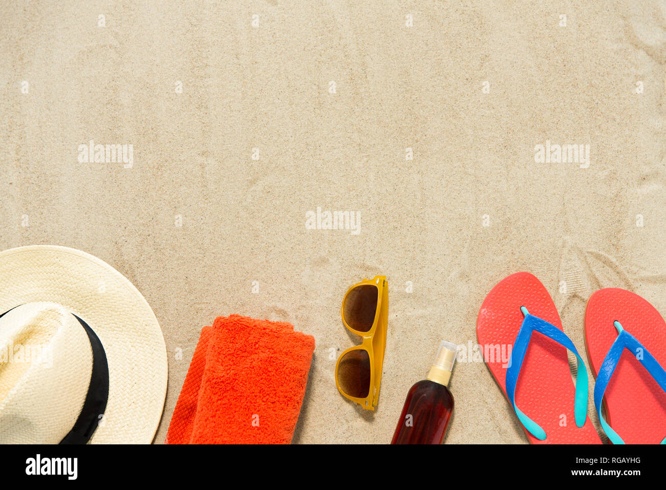 straw hat, flip flops and sunglasses on beach sand Stock Photo - Alamy