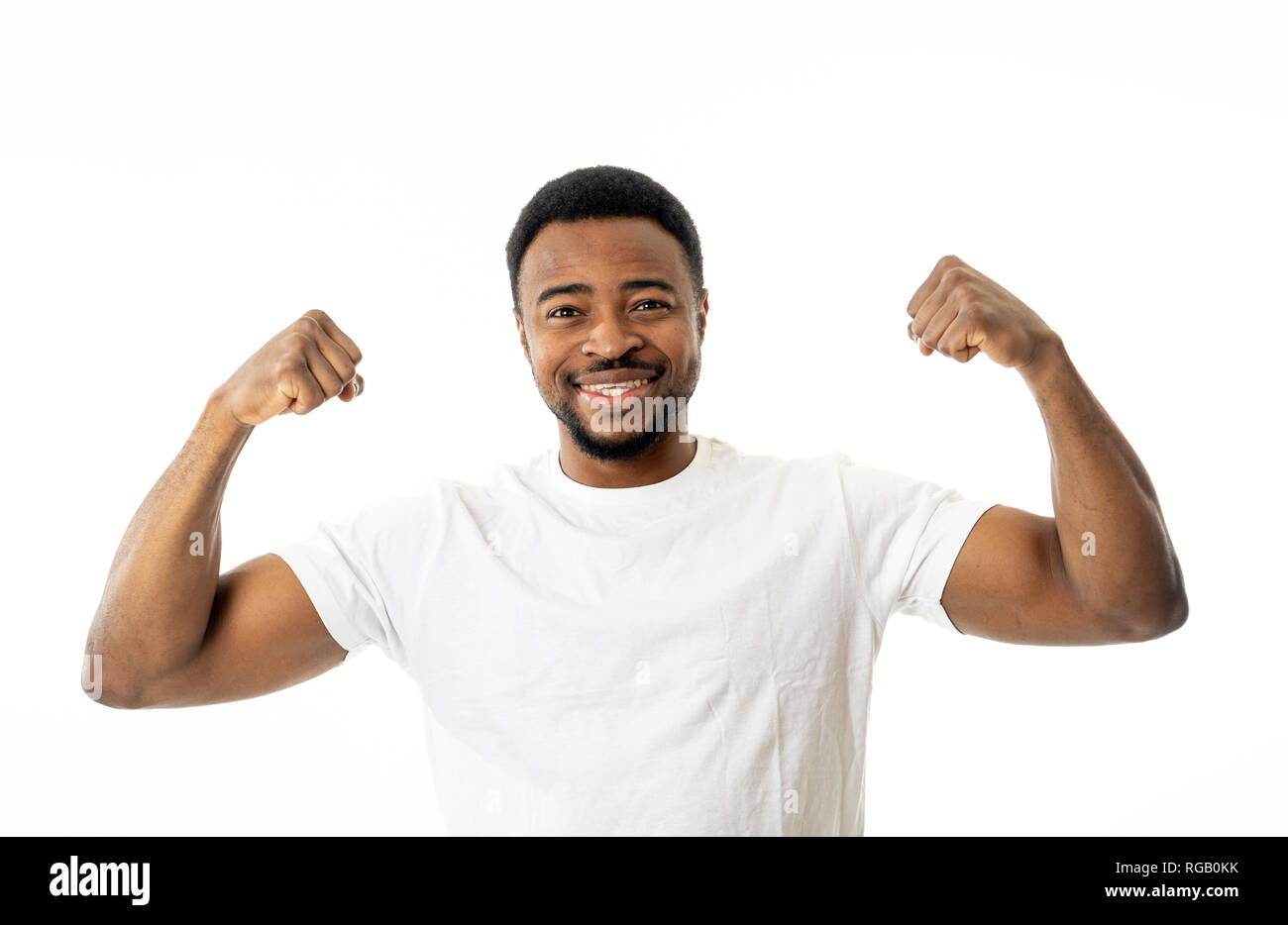 Young strong handsome african american man showing arms muscles smiling proud having fun in people, Happiness, Fitness, success Human emotions and fac Stock Photo