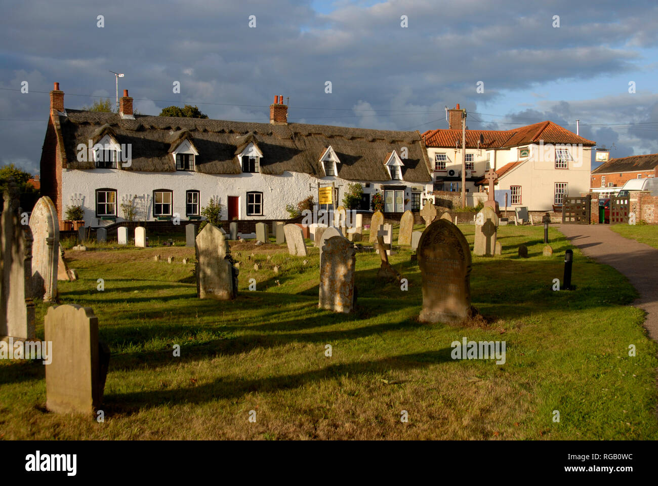 Row of attractive terraced thatched cottages, Ludham, Norfolk, England. Stock Photo