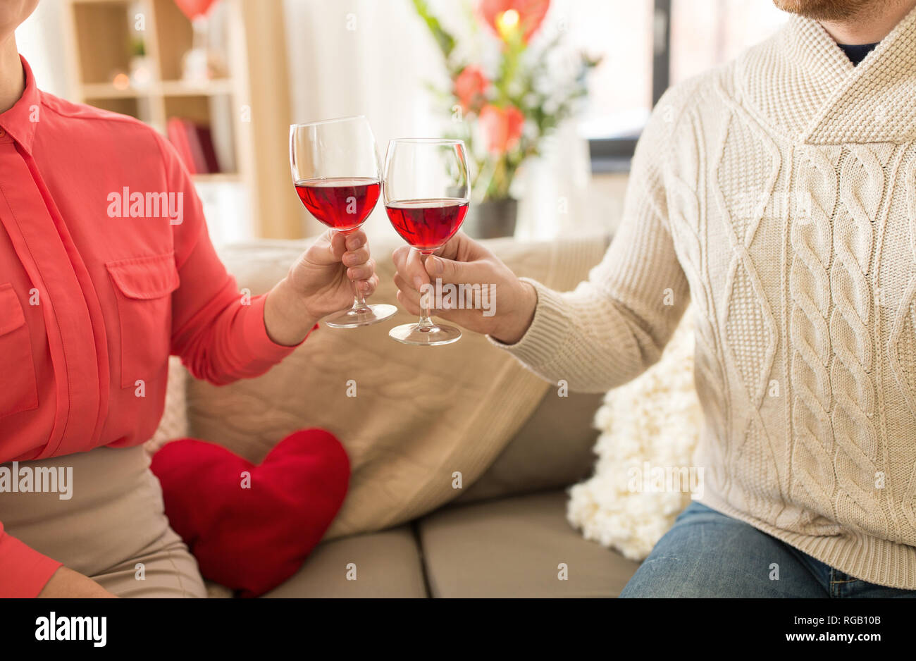 happy couple drinking red wine on valentines day Stock Photo - Alamy