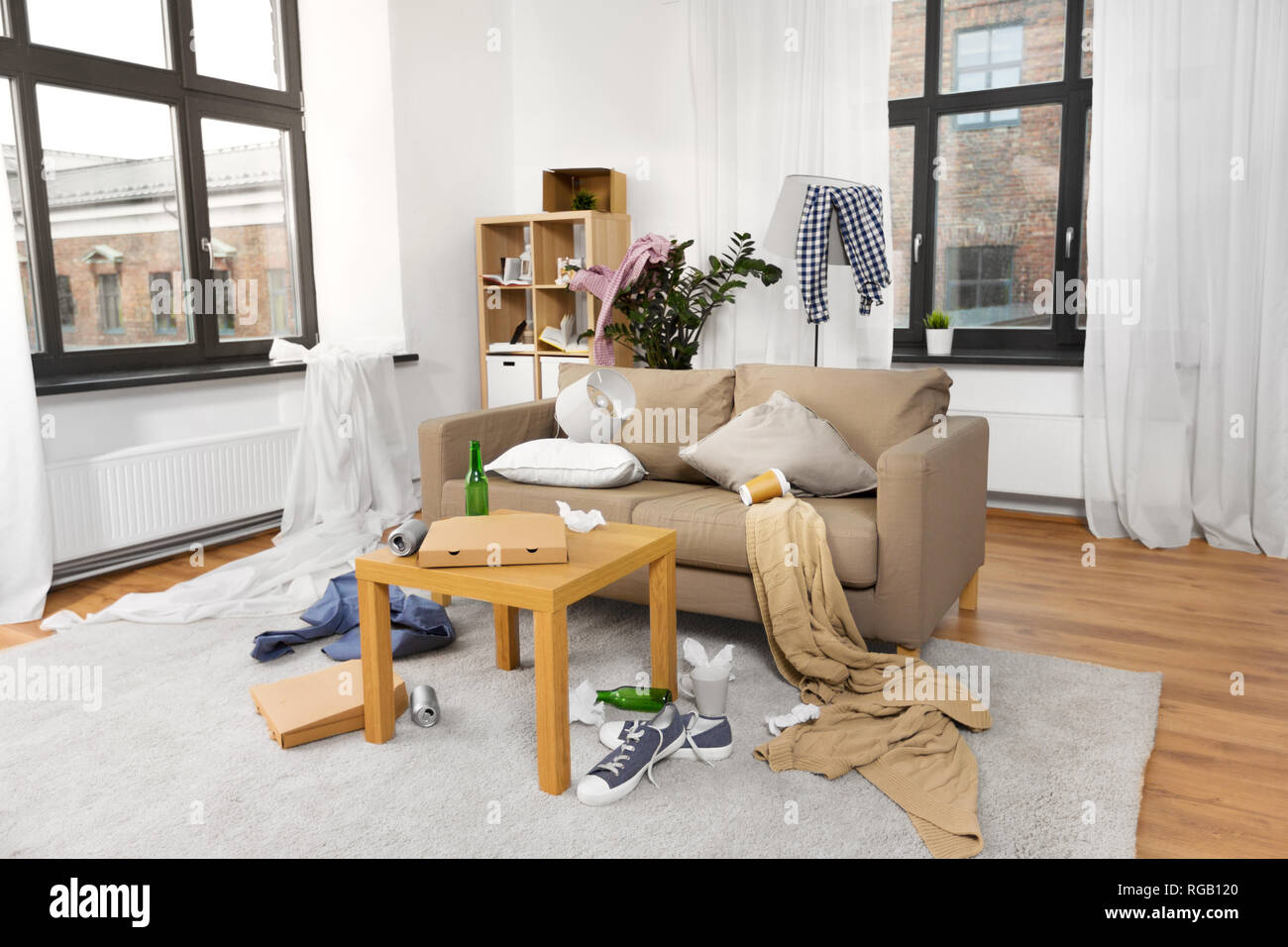 interior of messy home room with scattered stuff Stock Photo