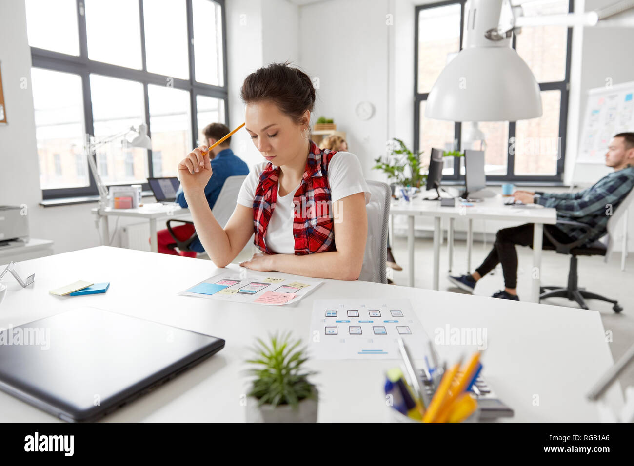 creative woman working on user interface at office Stock Photo