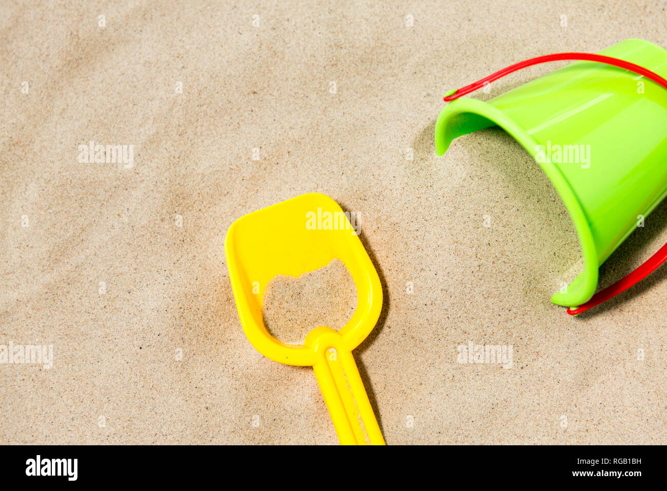 close up of toy bucket and shovel on beach sand Stock Photo Alamy