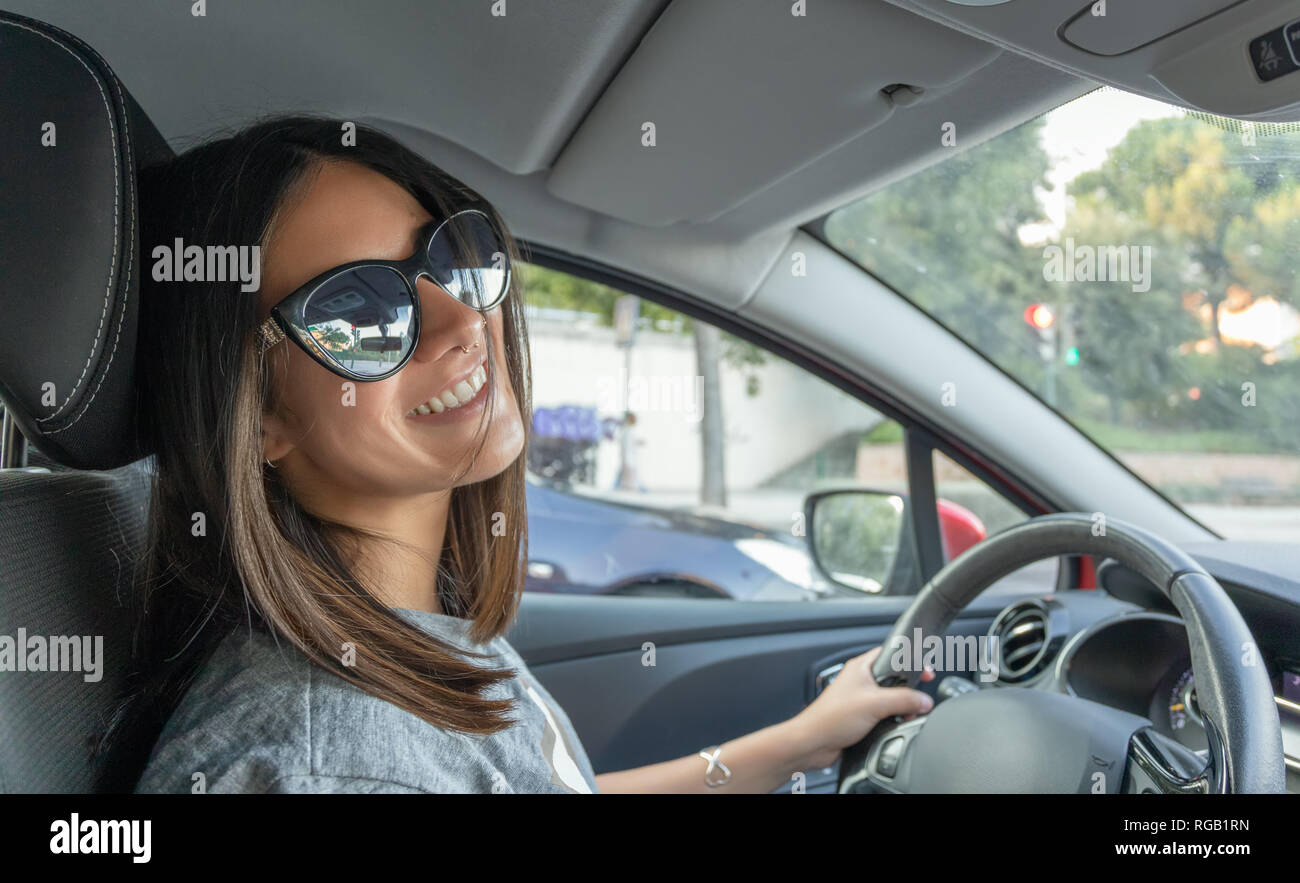 Girl sunglasses driving hi-res stock photography and images - Alamy