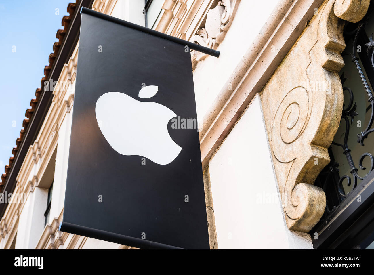 March 15, 2018 Pasadena / CA / USA - Apple logo above the entrance to the store located in an old building downtown Pasadena Stock Photo