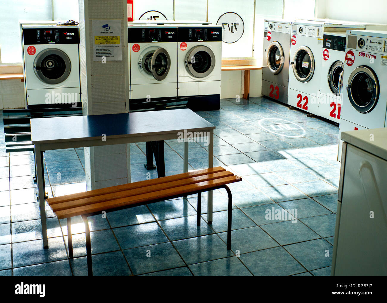 public laundromat empty interior Stock Photo