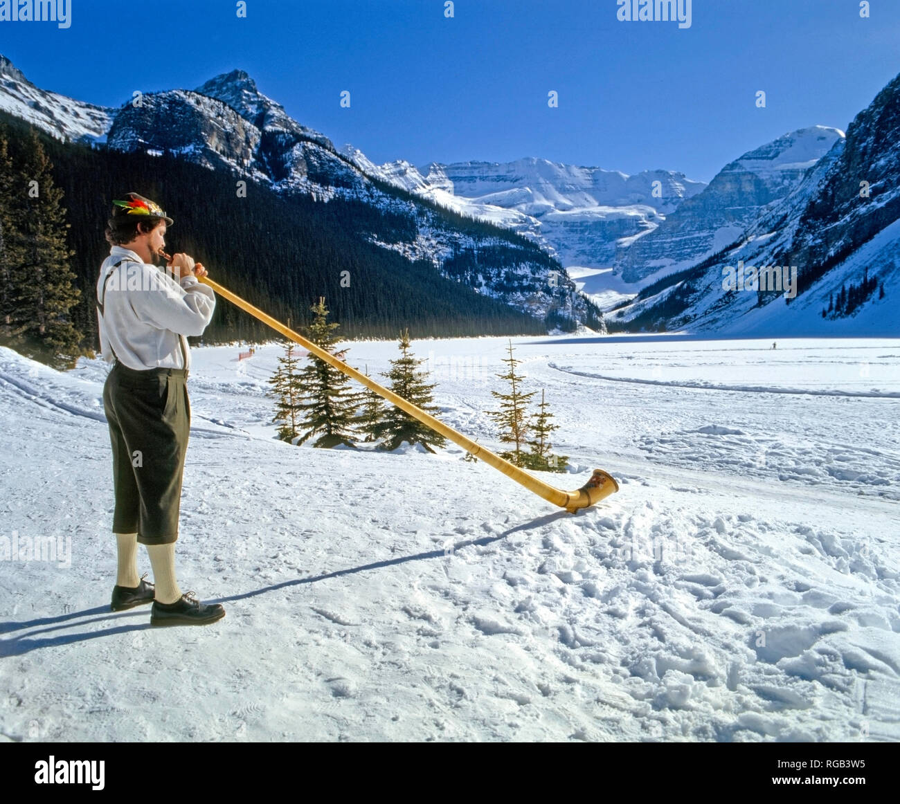 Alpenhorn;man; instrument;Rockies,winter, snow Stock Photo